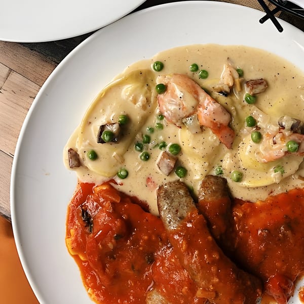 Bacco Ristorante & Bar's ravioli with creamy sauce, peas, shrimp, and sausage in marinara.